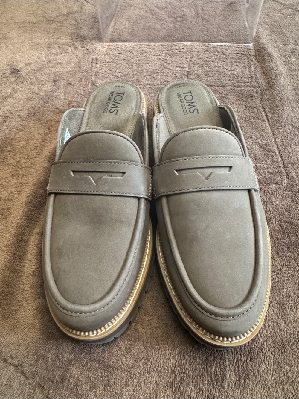 TOMS Cara mule loafers, featuring a slip-on design with a classic penny strap